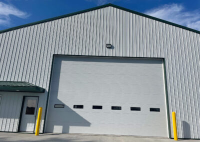 Hagan - A metal building with a yellow door.