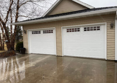Hunsaker - white garage door with two windows.