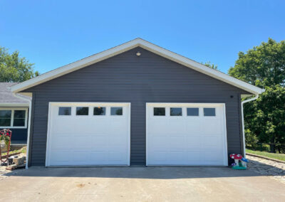 Two gray garage doors in a home.